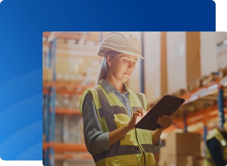 Construction worker reviewing clipboard